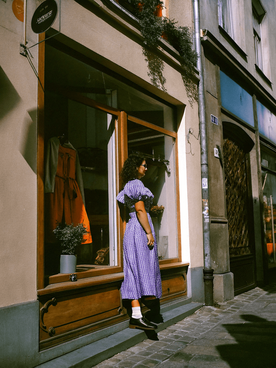 A woman standing on a side walk